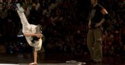 A breakdancer demonstrates both amazing strength and flexibility with a dynamic freeze.